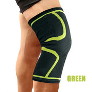 Green breathable knee compression sleeve worn on the leg