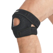 Black adjustable knee support brace in use