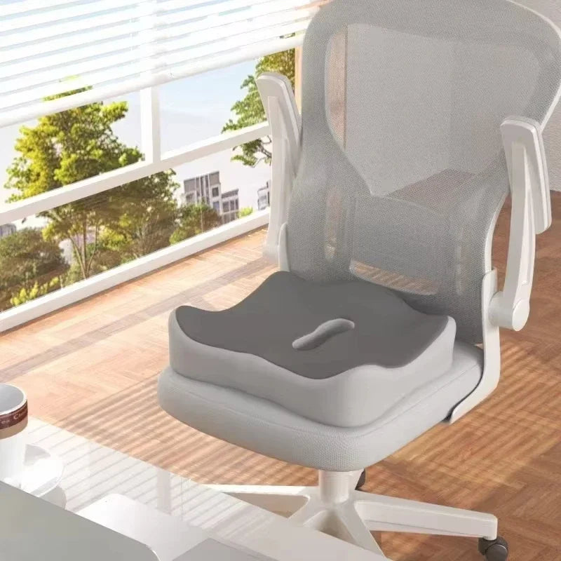 Ergonomic seat cushion positioned on an office chair